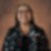 a photo of IHCRC's CFO, Deanna Holman, wearing a black shirt
