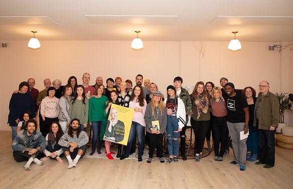 Group image of attendees at Jessie's book launch event in 2019 at Commune Yoga in Seattle
