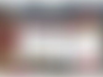 Three people smiling at a smartphone, with a laptop and phone displaying the Driftscape digital tourism app with Niagara Falls website content. Background features geometric wall.