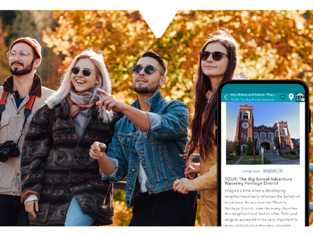 Four people in autumn clothes enjoy nature. A smartphone displays the Driftscape digital app for heritage sites featuring a historic building. Leaves are orange and brown.
