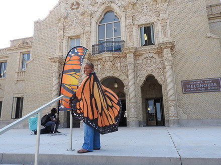Migration & Me Program Coordinator, Rev. Debra Williams, wears butterfly wings for the celebration!
