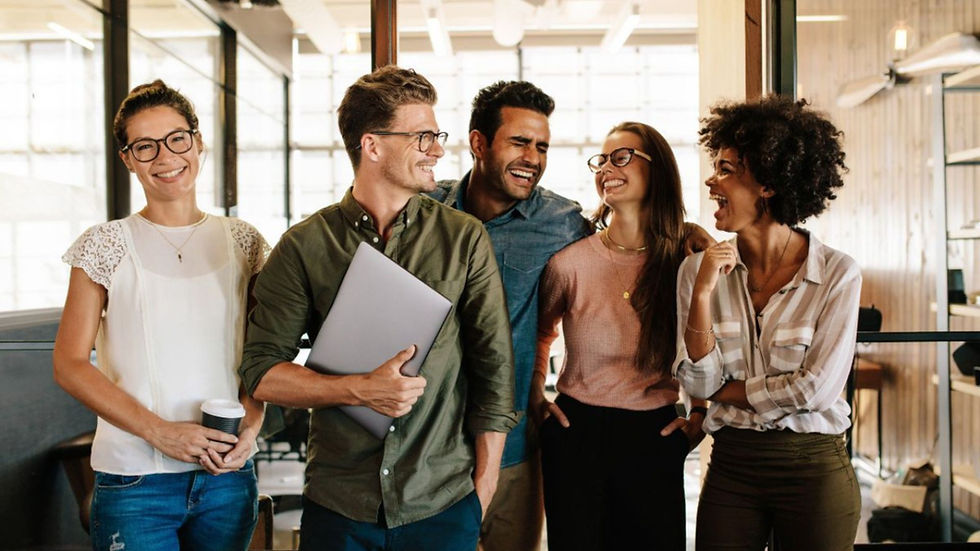 a group of staff members stood together in the workplace