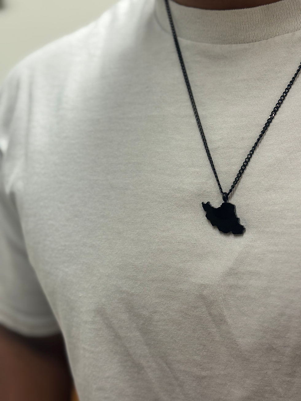 Thumbnail: Black Iran map pendant worn on model – Persian necklace, Iran chain, Persian jewelry for men