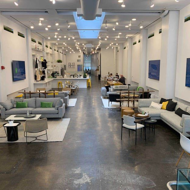Modern open office with Vested branding and lounge areas Project from Blueprint