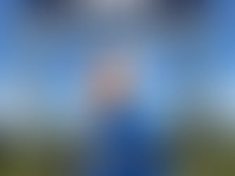 Jordan Vreeland in blue jacket under "Conversion Con 25" sign, standing at ranch gate with cloudy sky. Text: Jordan Vreeland, Speaker.