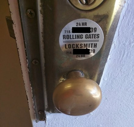 Photo of a locksmith sticker over a door knob