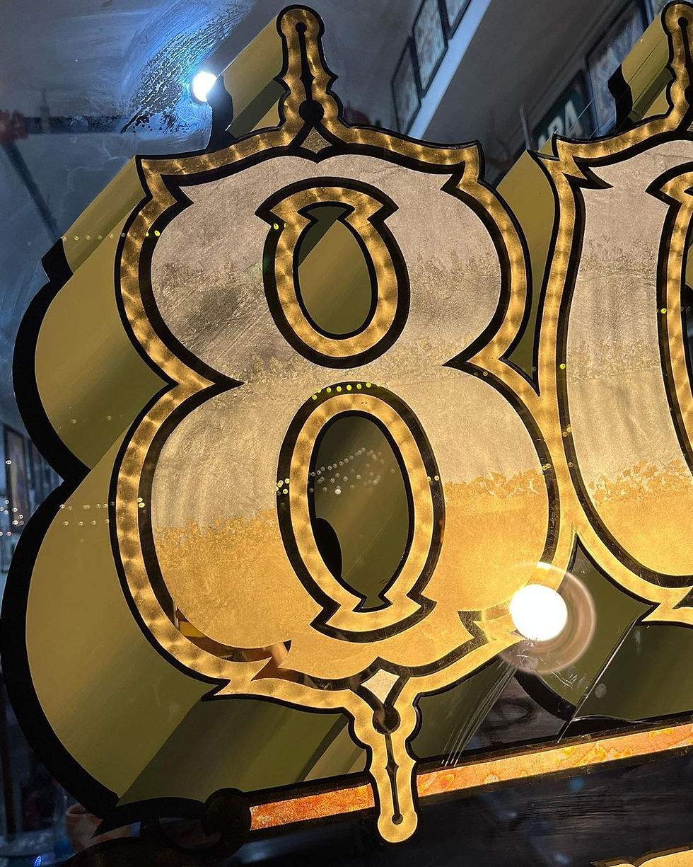 805 Ink Reversed Hand-Painted Window Logo with 23K Gold Leaf Sign by Sign Artist Alex Kurakake at Smart Alex Hand Painted Signs Orange County Sign Company Premium Sign Solutions West Los Angeles Irvine Los Angeles Newport Beach Anaheim Southern California