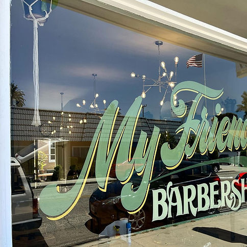 Conor Clipper Hands - My Friend's Barbershop Exterior Storefront Custom Hand-Painted Window Signage in Long Beach by Sign Artist Alex Kurakake of Smart Alex Signs - Orange County Hand-Painted Storefront Sign Company. Los Angeles Premium Sign Solutions Company near Newport Beach, Huntington Beach, Laguna Beach, Riverside, Pasadena, Belmont Shore, South Bay, Inland Empire, Tarzana, Torrance, Gardena. Call: 714-515-6205