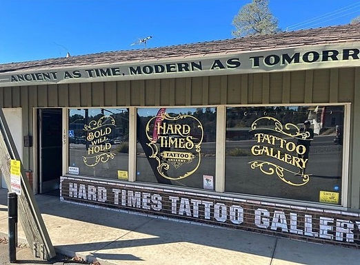 Hard Times Tattoo Gallery Exterior Storefront Hand-Painted Sign Package: 2' x 4 1/2' Wood Cutout Hand-Painted Signage, Reverse Hand-Painted Window Signs, 12' Exterior Storefront Hand-Painted Signage by Sign Artist Alex Kurakake of Smart Alex Signs - Orange County Hand-Painted Sign Company. Sign Hand-Painted at 183 Palm Ave. Auburn, CA 95603. Los Angeles Premium Hand-Painted Sign Solutions Company. Call: 714-515-6205
