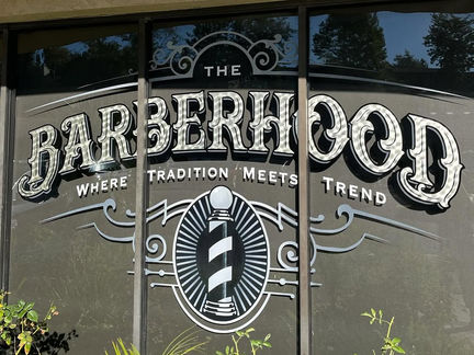 LAGUNA HILLS SOUTHERN CALIFORNIA Barbershop Business: The Barberhood Gold Leaf Gilded Exterior Window Storefront Hand-Painted Sign in Laguna Hills 92653 by Los Angeles Hand-Painted Sign Artist Alex Kurakake of Smart Alex Signs Hand-Painted Workshops Company
