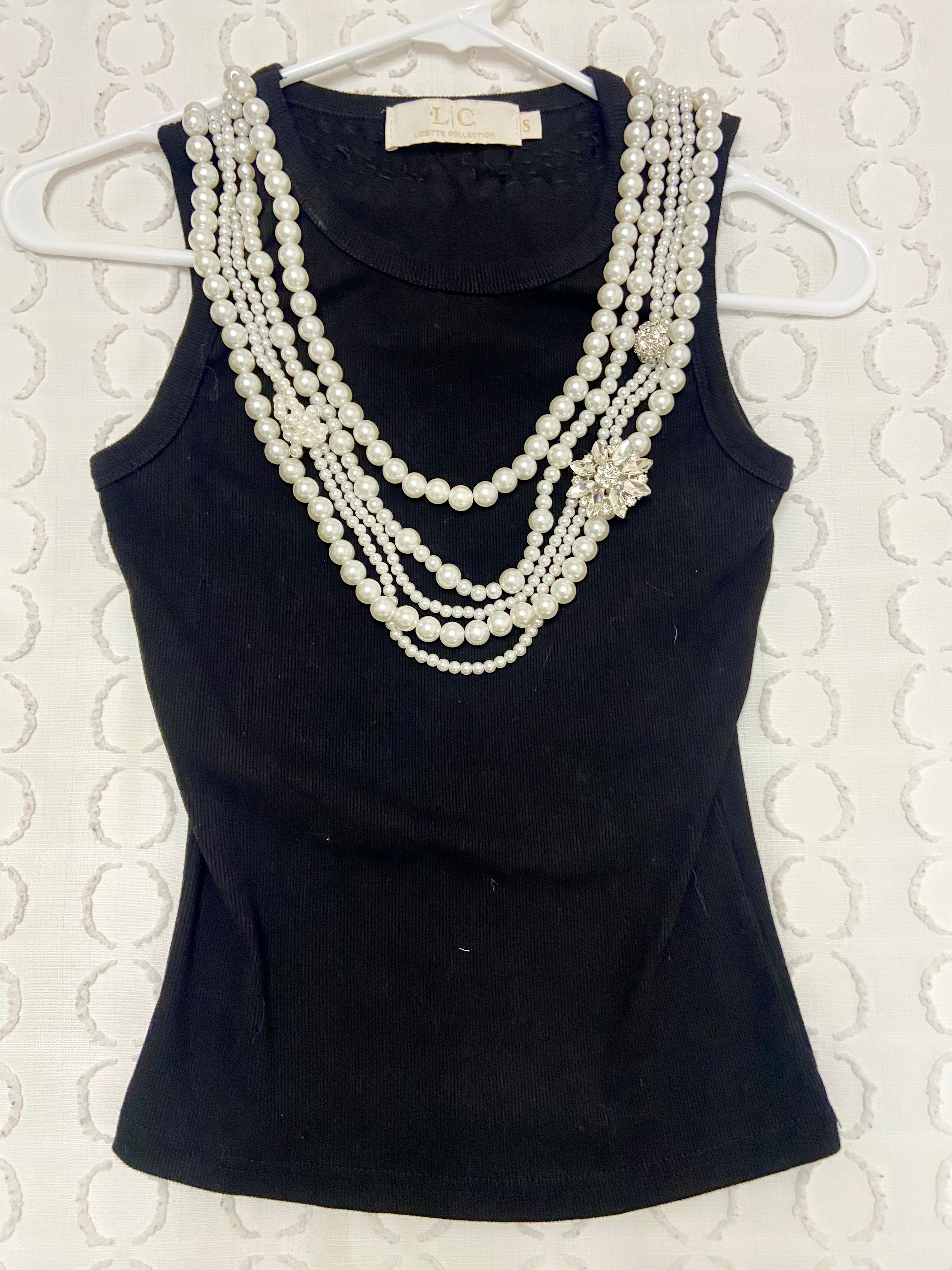 Elegant Pearl Necklace set on black sleevless top