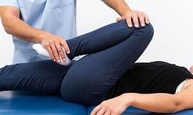 physiotherapist-doing-exercises-with-fem