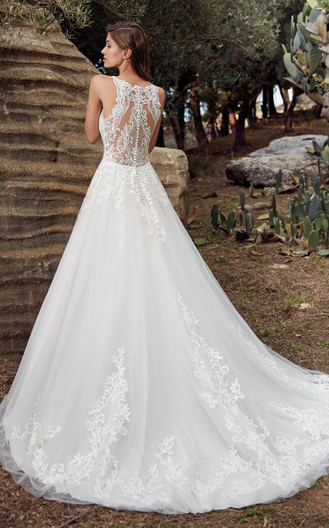 bride in lace and tulle ballgown wedding dress with illusion back lace
