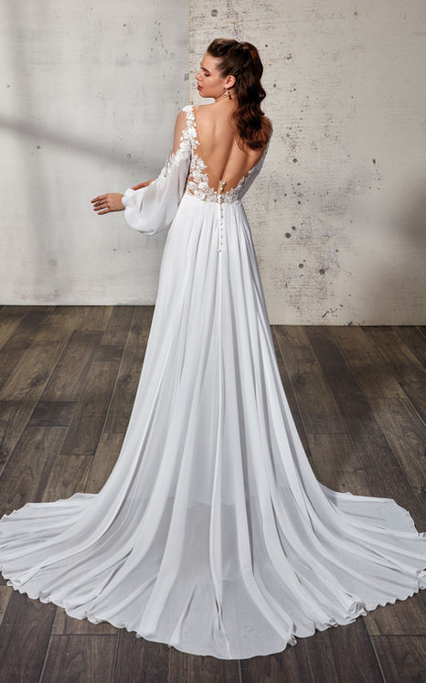 Long sleeve A-line wedding gown with lace details with bride