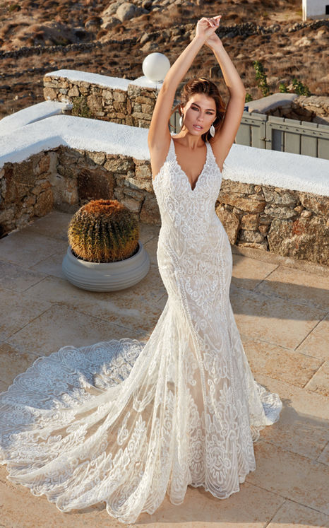 Bride in ivory fit-n-flare gown with beaded embroidery over tulle