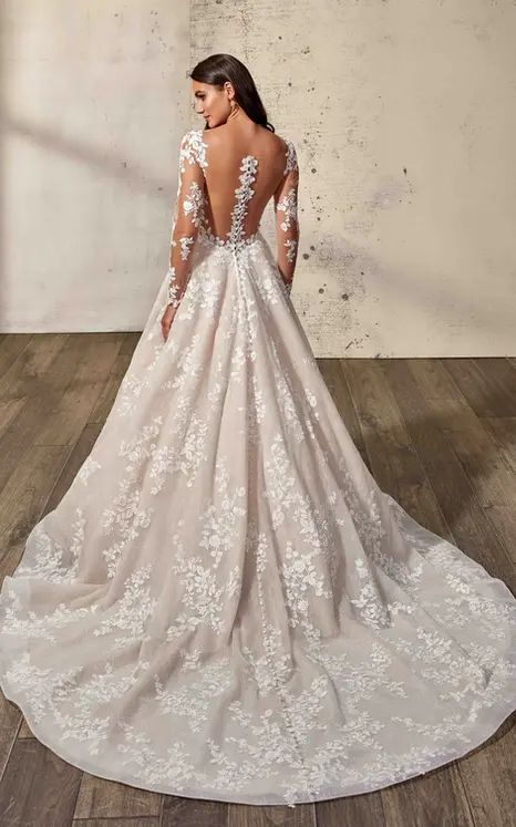 Back of Longsleeve wedding dress by italian wedding dress designer on a brunette bride with champagne tulle covered in lace