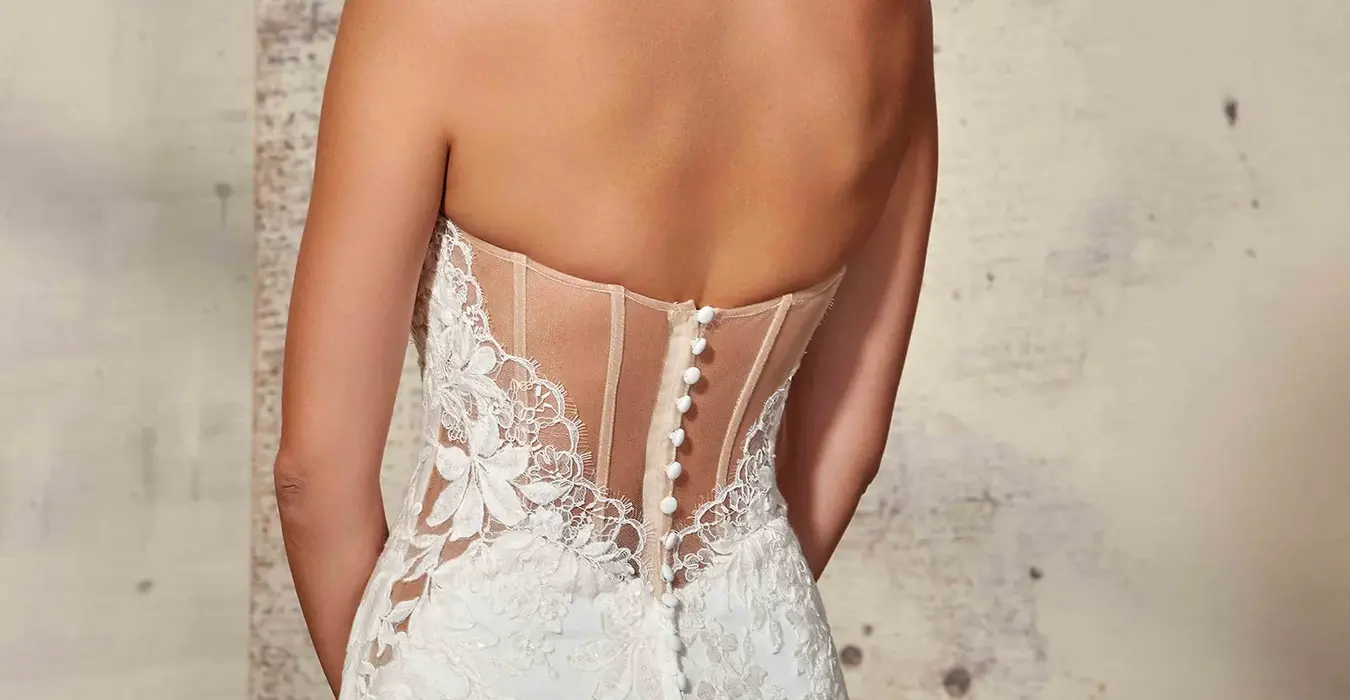 close up bride wearing wedding dress designer Eddy K, beautiful strapless fit-n-flare lace and sequins over crepe gown