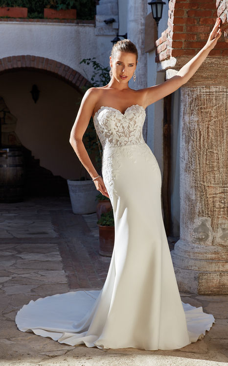 Eddy K Crepe mermaid wedding gown with sweetheart neckline on blonde model with pony tail