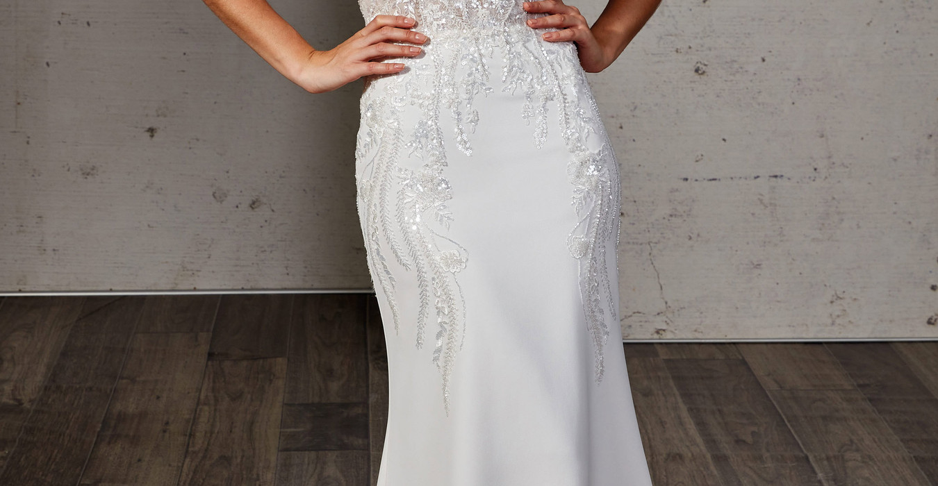 Wedding gown with heavily beaded lace over crepe and sweetheart neckline
