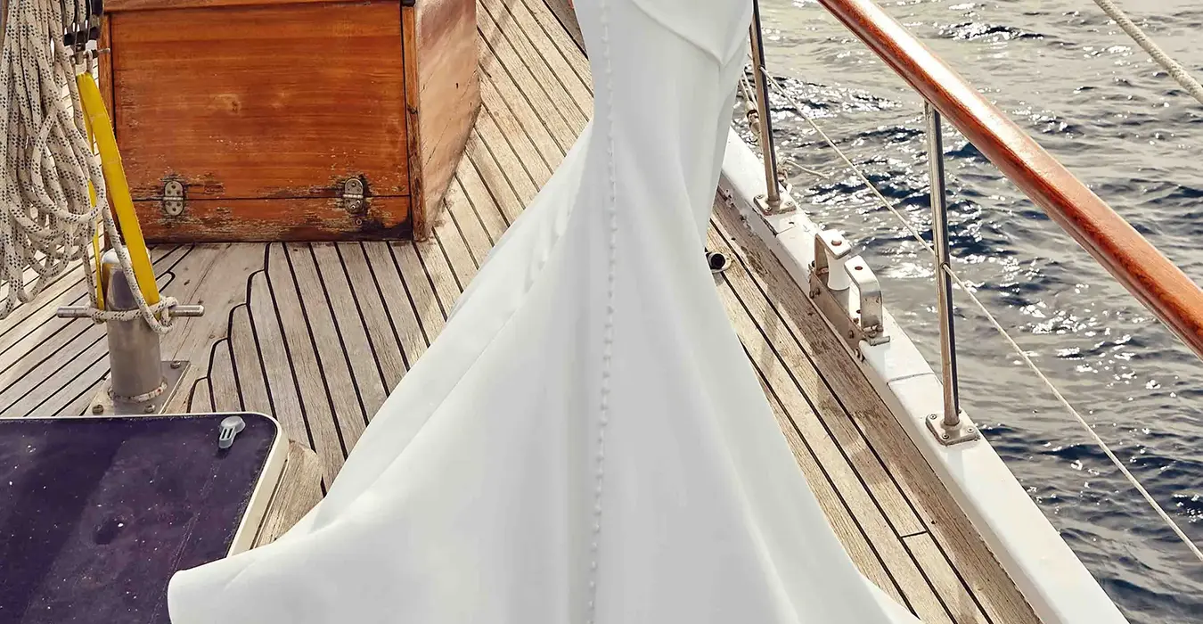 Back of a Sleeveless wedding gown by Italian wedding dress designer Eddy K with a lace strip through the back bodice