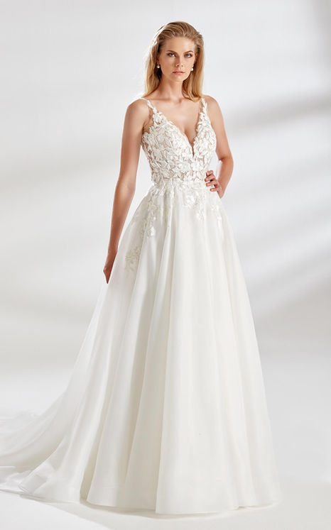 Bride in ivory organza ballgown wedding dress with ivory lace and pockets