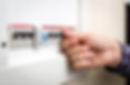 Closeup shot of man switching on fuseboard.jpg