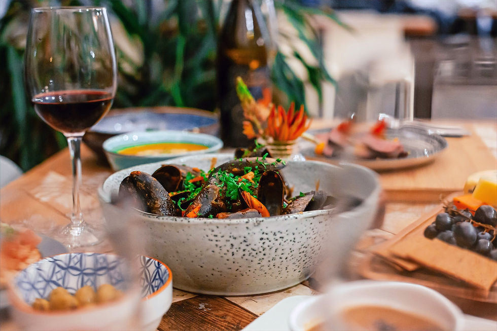 Close-up view of a chef plating a gourmet dish in a professional kitchen