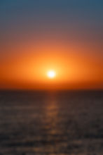 Sunset over the sea in San Antonio Ibiza with golden light on the water