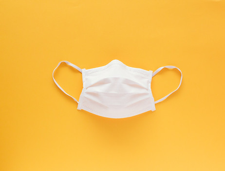 isolated-face-mask-middle-yellow-backgro