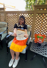 Owner Colette Spirer enjoying refreshments, Coke products and a custom cookie from Jolly Holiday Bakery, on the patio on Walt's apartment during Walt's Main Street Story, a guided tour at Disneyland Park.