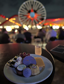 World of Color Dessert Party at Disney California Adventure offerings typically include a wide range of sweet treats such as cupcakes, cookies, chocolates, and seasonal pastries, along with a selection of fruit and cheese. Guests can also enjoy a variety of non-alcoholic and alcoholic beverages! 🥂