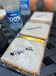 Enjoying refreshments, Coke products and a custom cookie from Jolly Holiday Bakery, on the patio on Walt's apartment during Walt's Main Street Story, a guided tour at Disneyland Park.