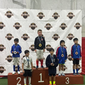 Podium with six Y10 boys at tournament