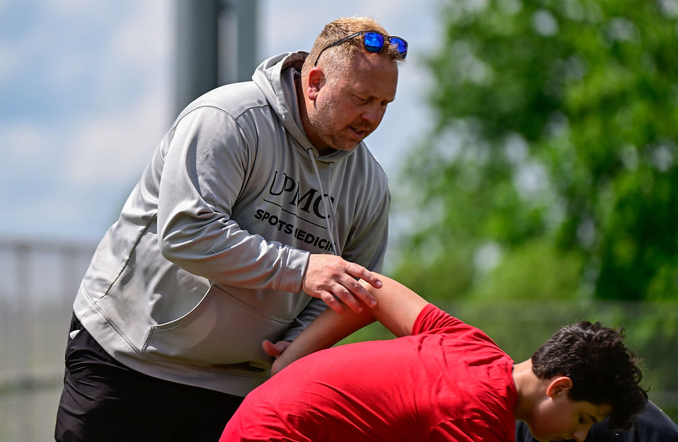 Coach Marcel Pastoor working with youth athlete to master technique of speed