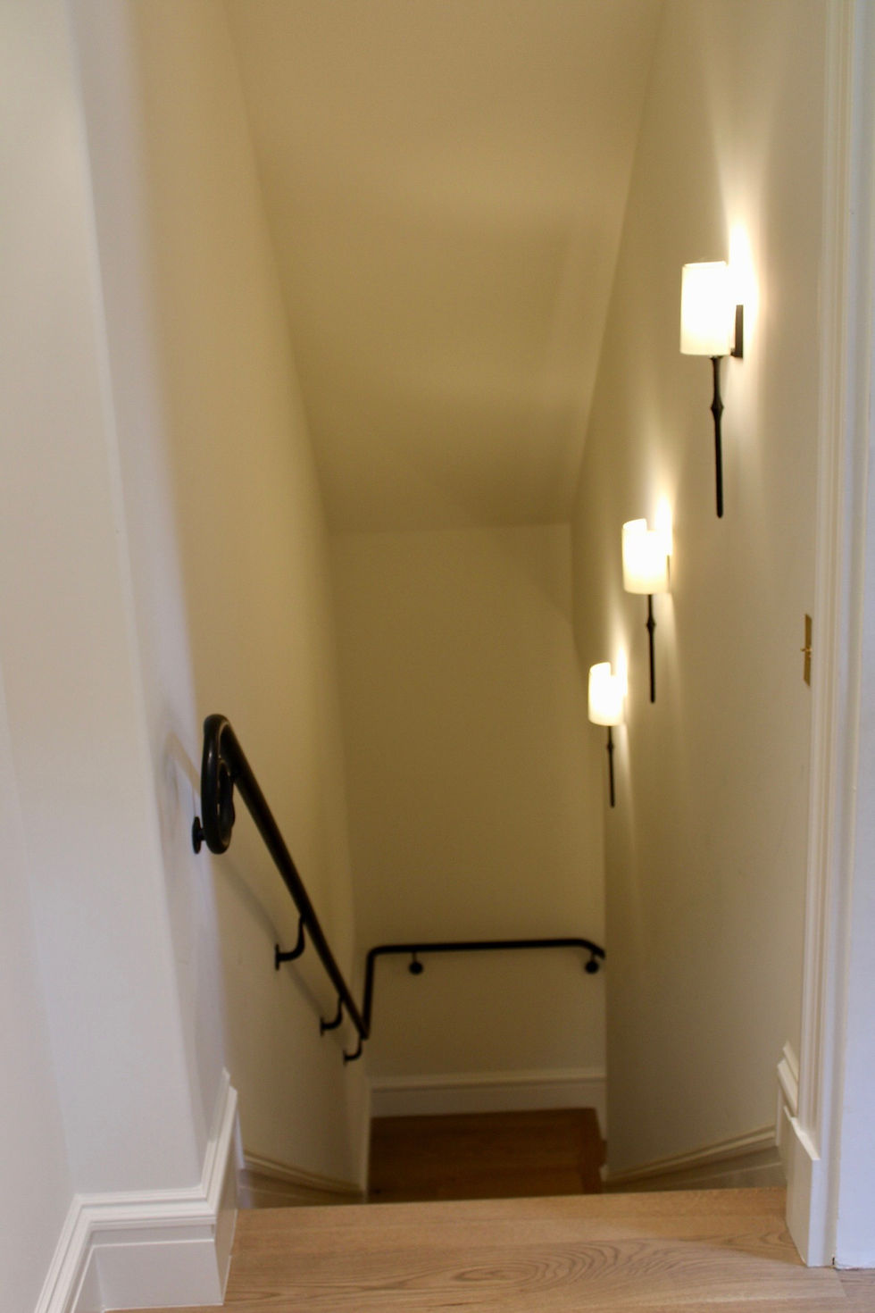 Stairs to the basement entertaining space.
