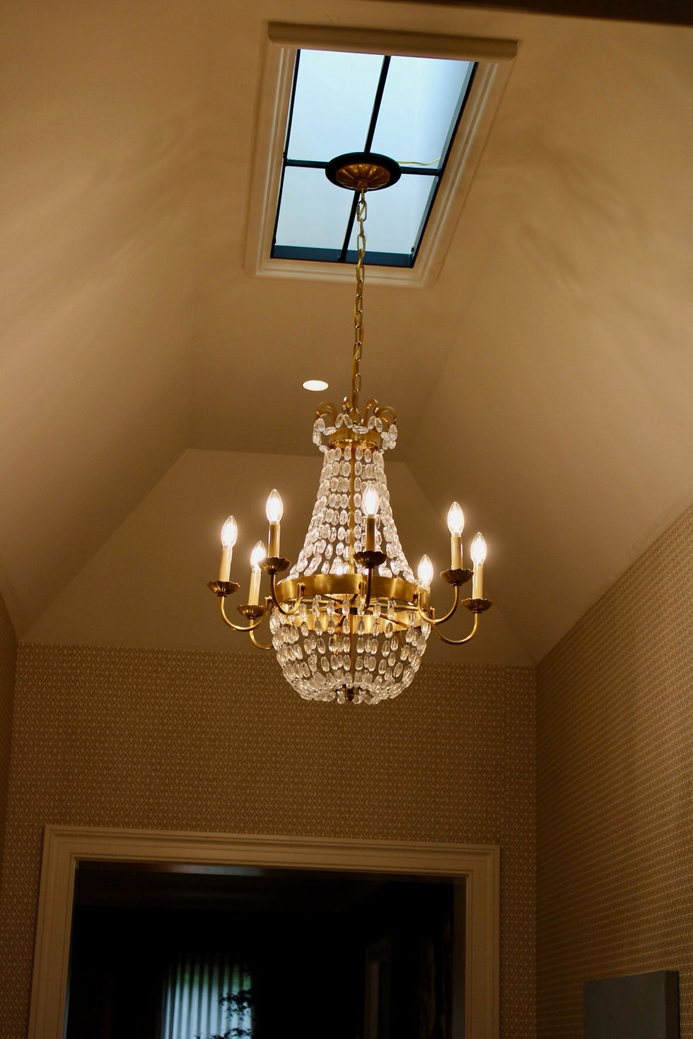 Visual Comfort chandelier in the second story hall designed by C. Walker Designs