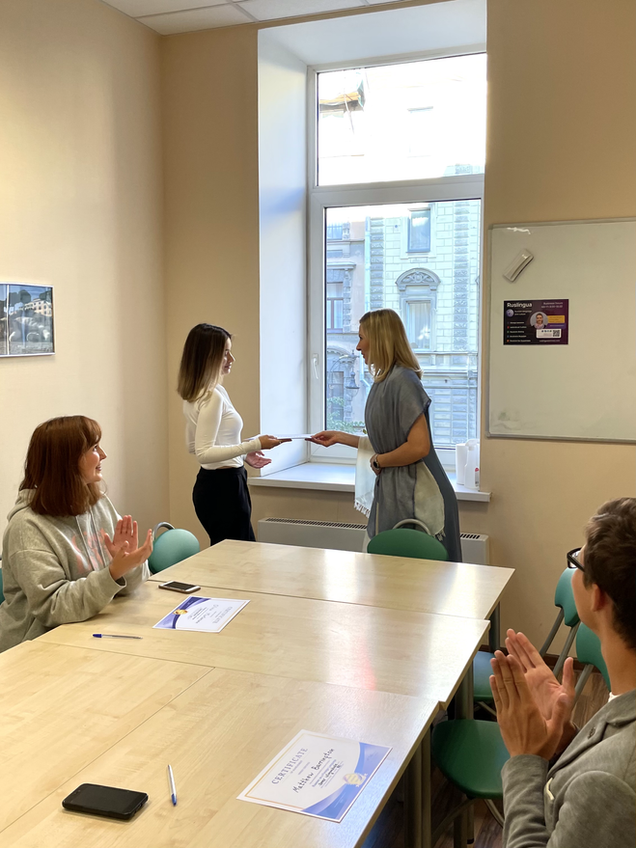 Student receives diploma about improved Russian language level