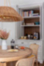 Custom kitchen built-in coffee station with cabinetry and shelving by Zarra Development