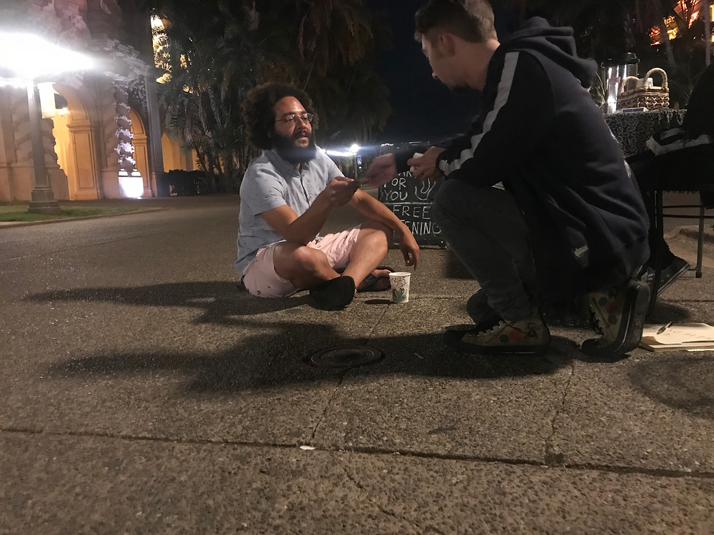A card trick being offered at the last Free Listening session