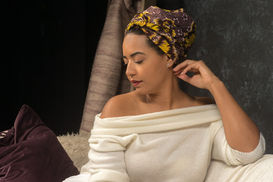 Curve model in African headwrap looking down.