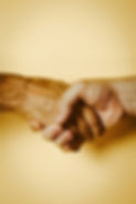 Compassionate handshake.