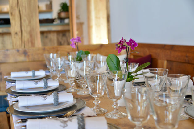 Chalet Rosiere luxurious dining table with elegant decoration and wine glasses