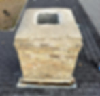 Brick chimney with deteriorated mortar and damaged chimney crown before roof repair
