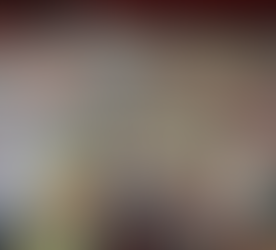 Tattoo studio floor covered in a collage of colorful comic book pages, creating a unique artistic design throughout the space.