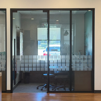 Interior glass doors installed in a commercial office space by Chasteen G&M