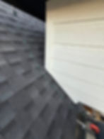 Finished roof flashing repair creating a watertight seal along exterior wall