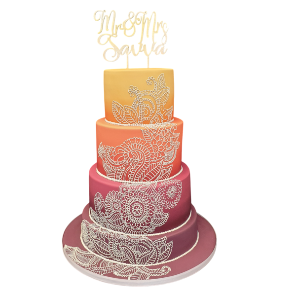 Five-tier ombré wedding cake with intricate white lace designs in sugar paste.
