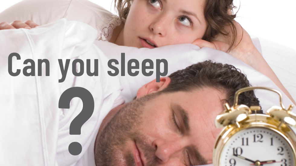 Woman awake, lying next to a sleeping man in bed. Alarm clock reads 8:10. Text: "Can you sleep?" Mood appears restless.