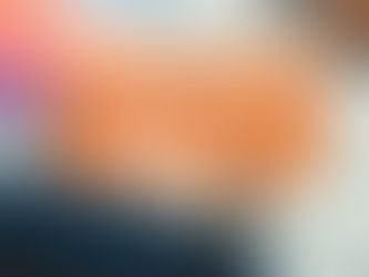 Man reading a book on habits next to a colorful computer screen. Text: "Change Unwanted Habits This September" on orange background.