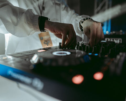 Professional event photography of DJ working